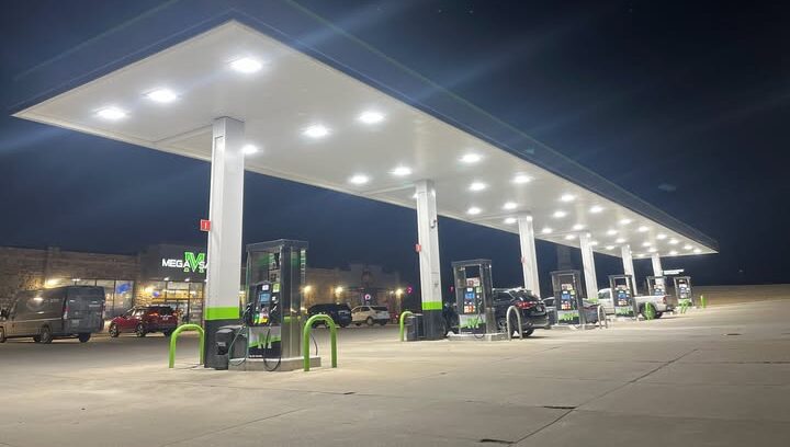 A gas station pump bank with recessed lighting
